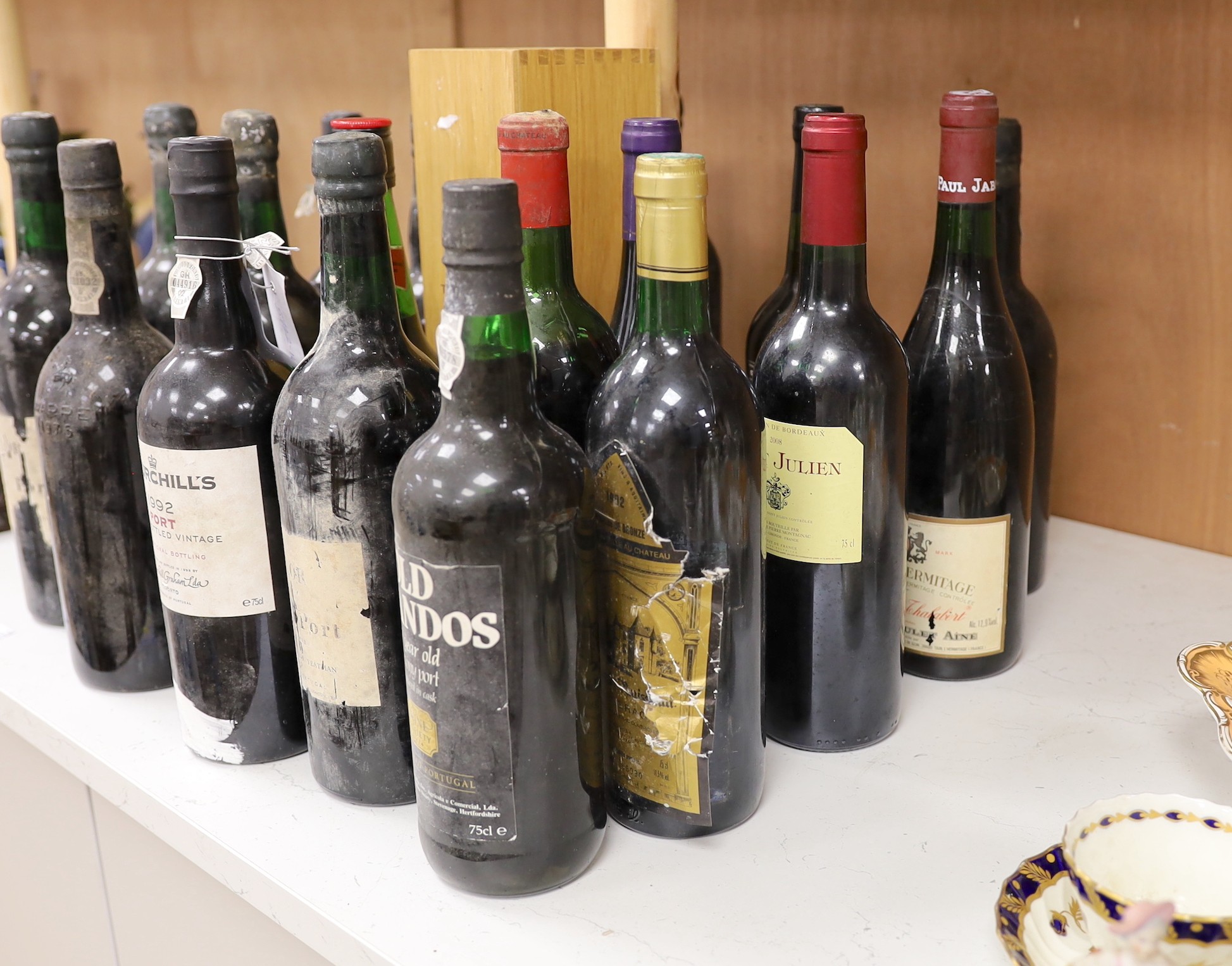 Six various bottles of wine including Croz Hermitage, Saint Julien, Chateau Beychevelle etc. and 16 bottles of port, mostly Taylor’s, varying vintages.